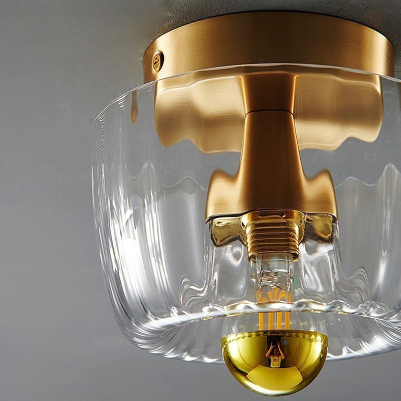 Moderne Wandbeleuchtung mit klarem Glasschirm, gebürstete Wandleuchte